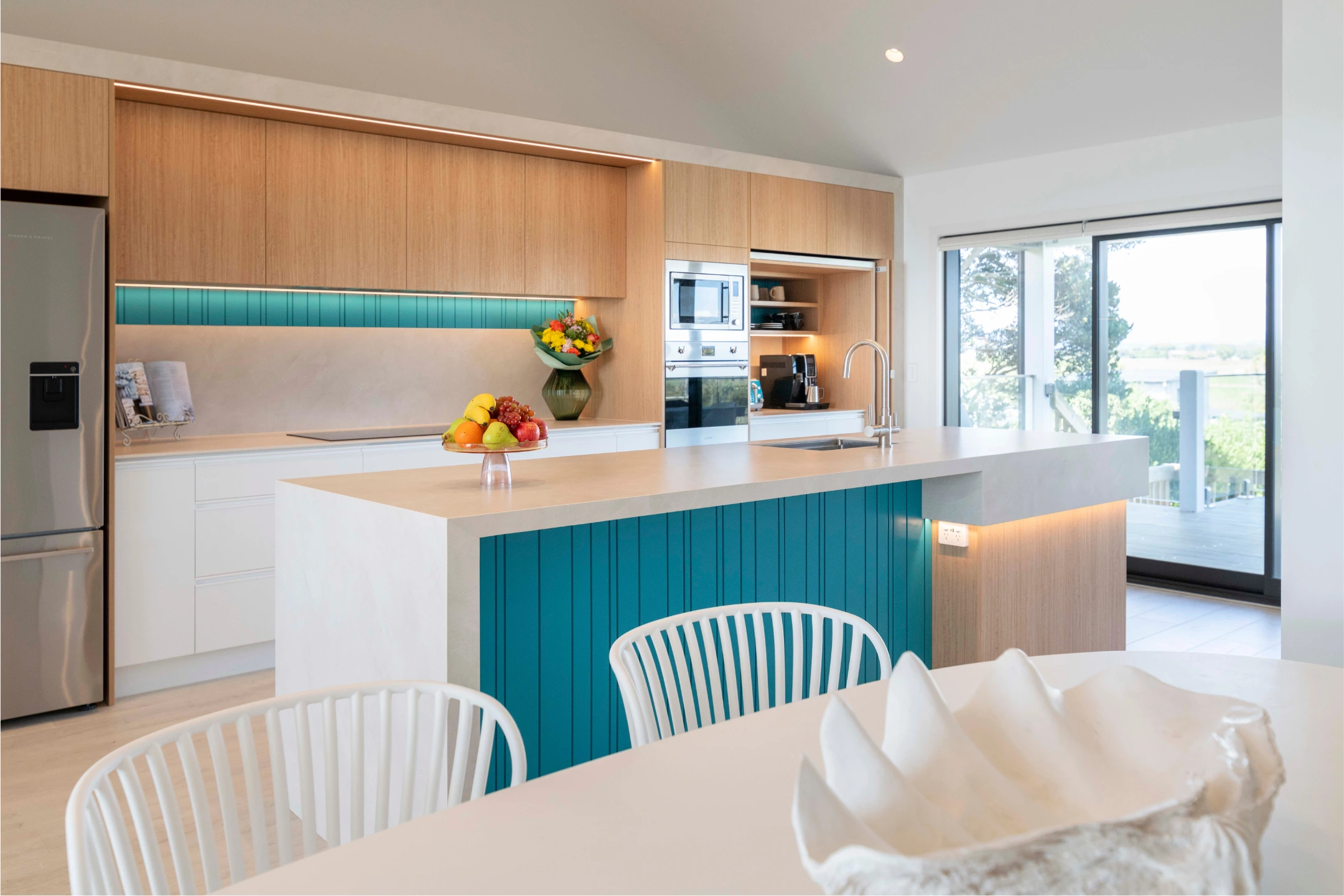 entertainers-kitchen-design-bay-of-plenty Open-plan kitchen with island and bar seating
