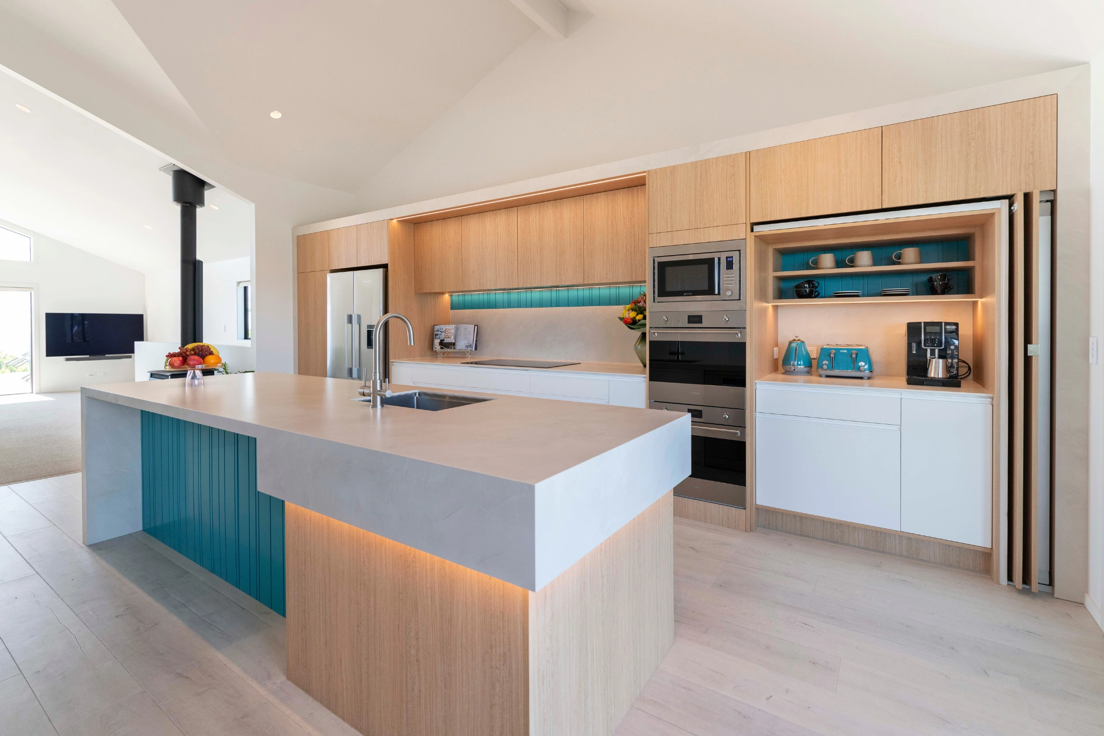 Complex benchtop and lighting in island design detail