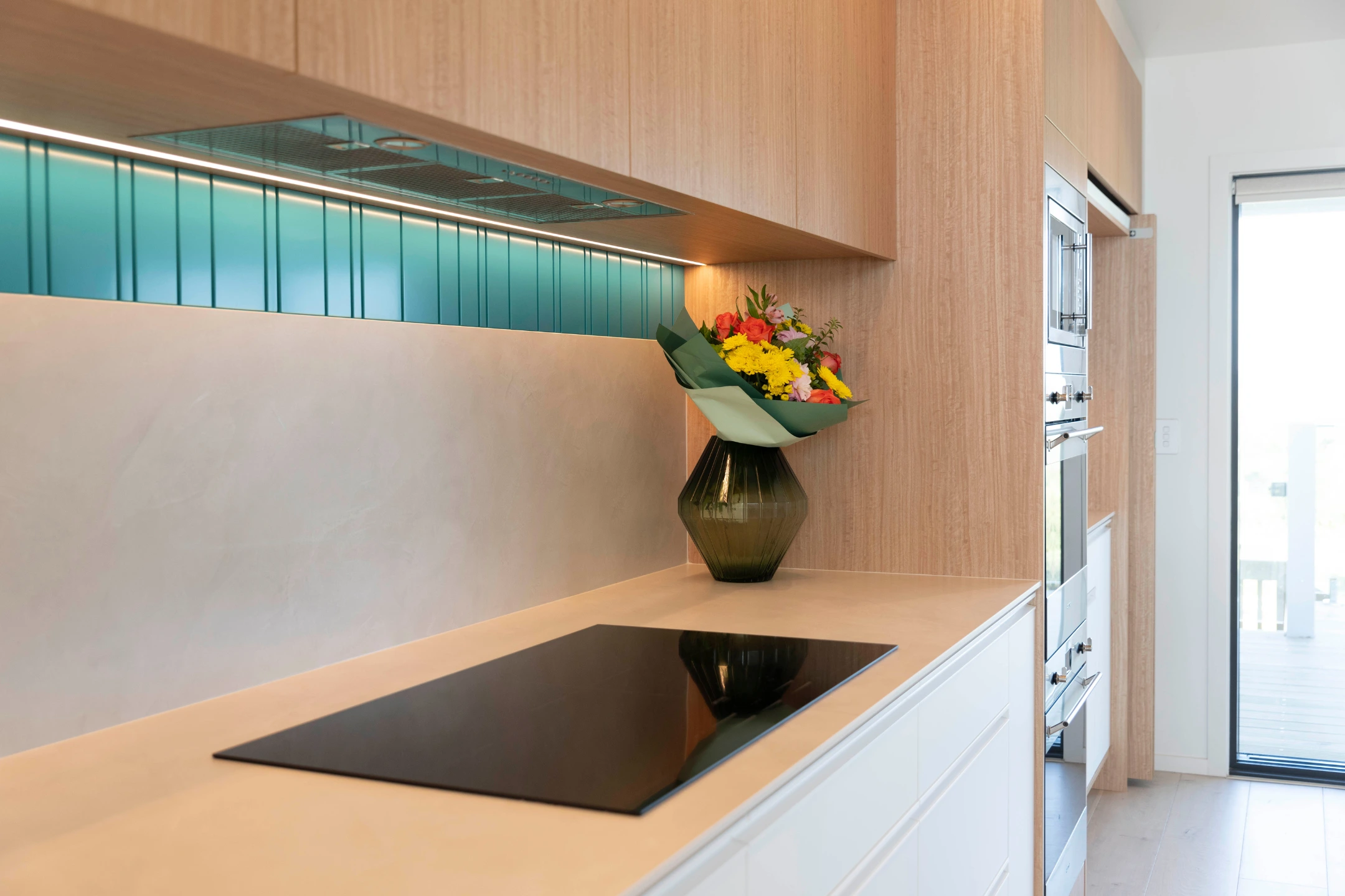 mixed-material-kitchen-remodel Mixed-material kitchen with timber, porcelain, and steel finishes