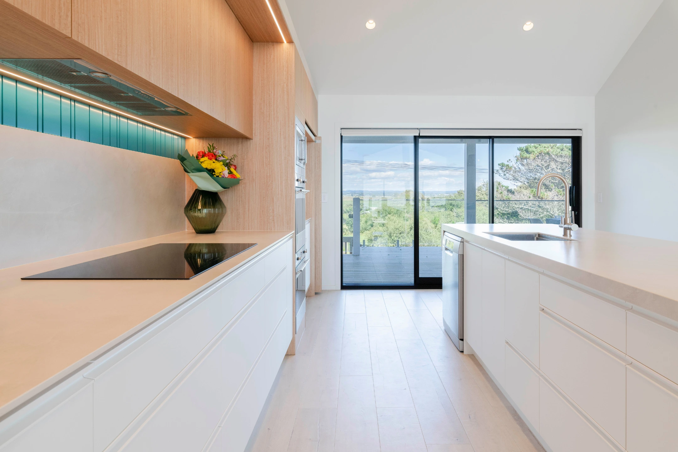 A simple porcelain benchtop, cut with minimal waste versus island mitred edge detail.